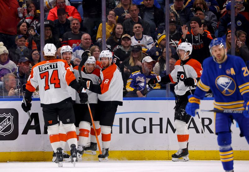 Apr 5, 2024; Buffalo, New York, USA;  Philadelphia Flyers left wing Noah Cates (27) celebrates his goal with teammates during the second period against the Buffalo Sabres at KeyBank Center. Mandatory Credit: Timothy T. Ludwig-USA TODAY Sports