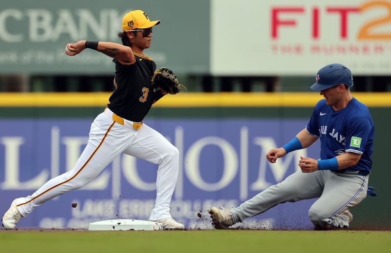 Mar 5, 2024; Bradenton, Florida, USA;  Pittsburgh Pirates infielder/outfielder Ji Hwan Bae (3) forces out Toronto Blue Jays left fielder Daulton Varsho (25) and throws the ball to first base during the first inning at LECOM Park. Mandatory Credit: Kim Klement Neitzel-USA TODAY Sports