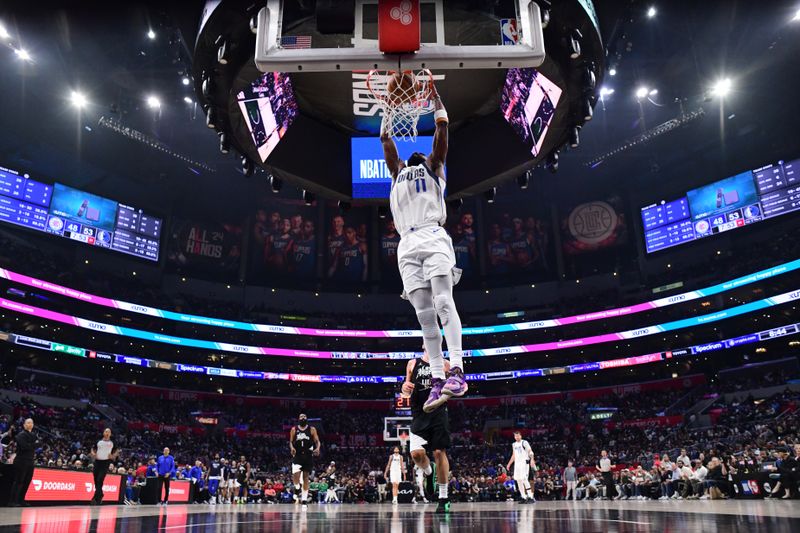 LOS ANGELES, CA - APRIL 23: Kyrie Irving #11 of the Dallas Mavericks goes to the basket during the game against the LA Clippers during Round 1 Game 2 of the 2024 NBA Playoffs on April 23, 2024 at Crypto.Com Arena in Los Angeles, California. NOTE TO USER: User expressly acknowledges and agrees that, by downloading and/or using this Photograph, user is consenting to the terms and conditions of the Getty Images License Agreement. Mandatory Copyright Notice: Copyright 2024 NBAE (Photo by Adam Pantozzi/NBAE via Getty Images)