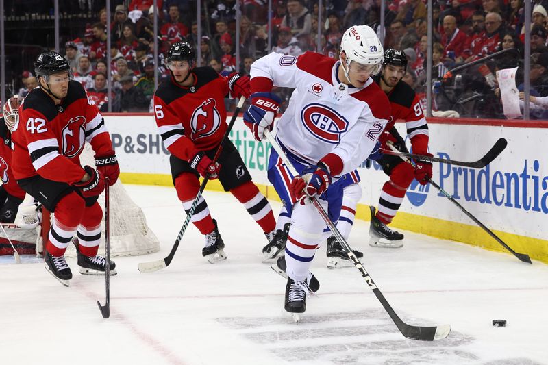 Jan 17, 2024; Newark, New Jersey, USA; Montreal Canadiens left wing Juraj Slafkovsky (20) skates with the puck against the Montreal Canadiens during the third period at Prudential Center. Mandatory Credit: Ed Mulholland-USA TODAY Sports