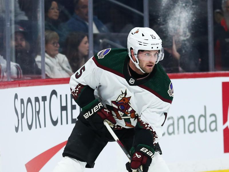 Nov 18, 2023; Winnipeg, Manitoba, CAN;  Arizona Coyotes forward Alexander Kerfoot (15) looks to make a pass against the Winnipeg Jets during the first period at Canada Life Centre. Mandatory Credit: Terrence Lee-USA TODAY Sports