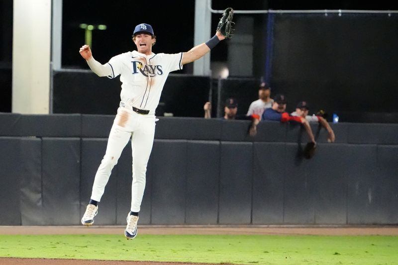 Sep 21, 2025; Tampa, Florida, USA; Tampa Bay Rays shortstop Carson Williams (7) reacts after throwing a wild throw to first during the fifth inning against the Boston Red Sox at George M. Steinbrenner Field. Mandatory Credit: Dave Nelson-Imagn Images