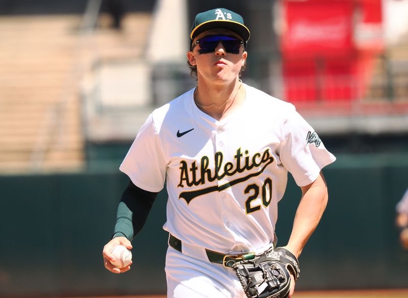 May 25, 2024; Oakland, California, USA; Oakland Athletics second baseman Zack Gelof (20) returns to the dugout after the top of the sixth inning against the Houston Astros at Oakland-Alameda County Coliseum. Mandatory Credit: Kelley L Cox-USA TODAY Sports