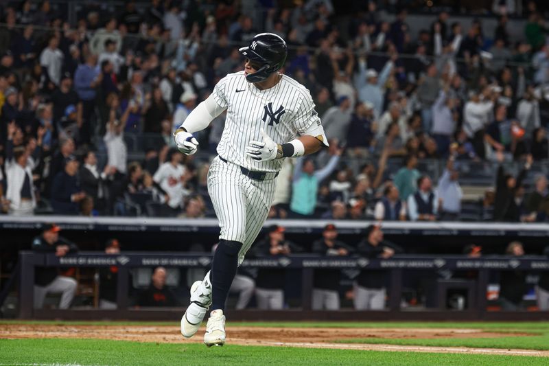 Sep 24, 2024; Bronx, New York, USA; New York Yankees center fielder Aaron Judge (99) reacts after hitting a solo home run during the fourth inning against the Baltimore Orioles at Yankee Stadium. Mandatory Credit: Vincent Carchietta-Imagn Images