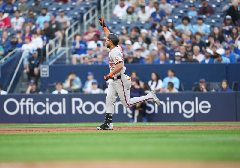 Jun 3, 2024; Toronto, Ontario, CAN; Baltimore Orioles right fielder Anthony Santander (25) runs the bases and celebrates after hitting a two run home run against the Toronto Blue Jays during the second inning at Rogers Centre. Mandatory Credit: Nick Turchiaro-USA TODAY Sports