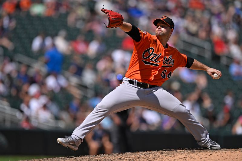 Jul 8, 2023; Minneapolis, Minnesota, USA; Baltimore Orioles pitcher Danny Coulombe (54) delivers a pitch against the Minnesota Twins during the ninth inning at Target Field. Mandatory Credit: Nick Wosika-USA TODAY Sports