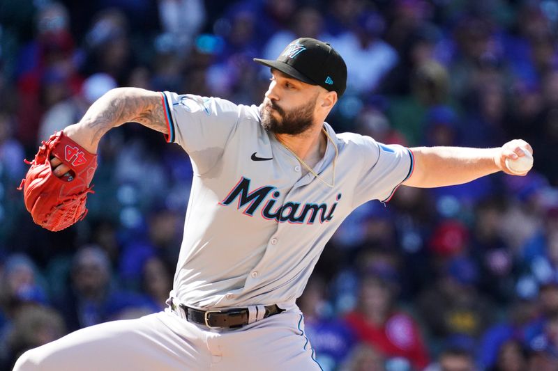 Apr 21, 2024; Chicago, Illinois, USA; Miami Marlins pitcher Tanner Scott (66) throws the ball against the Chicago Cubs during the seventh inning at Wrigley Field. Mandatory Credit: David Banks-USA TODAY Sports