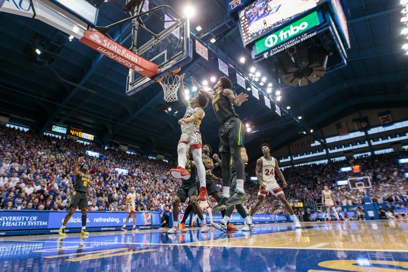 Feb 18, 2023; Lawrence, Kansas, USA; Kansas Jayhawks forward Jalen Wilson (10) and Baylor Bears forward Jalen Bridges (11) go up for a rebound during the second half at Allen Fieldhouse. Mandatory Credit: William Purnell-USA TODAY Sports