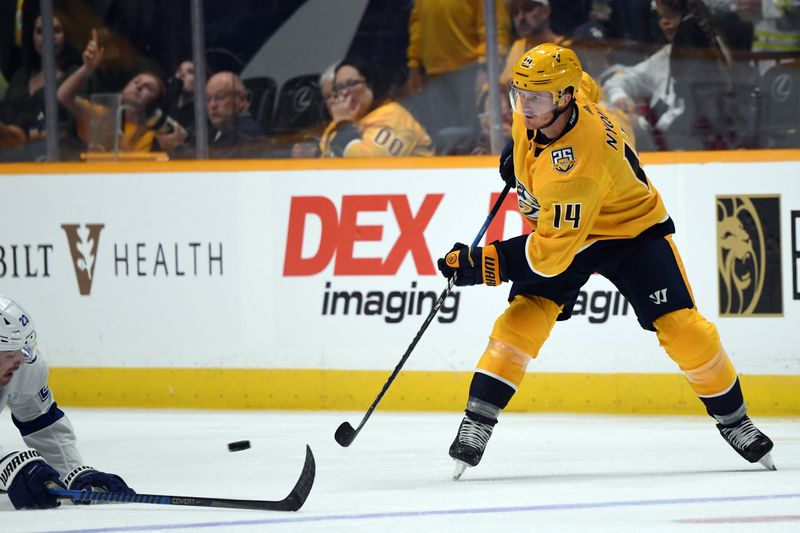 Sep 27, 2023; Nashville, Tennessee, USA; Nashville Predators left wing Gustav Nyquist (14) passes the puck against Tampa Bay Lightning center Michael Eyssimont (23) during the second period at Bridgestone Arena. Mandatory Credit: Christopher Hanewinckel-USA TODAY Sports