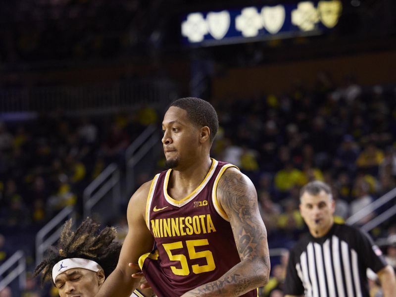 Jan 22, 2023; Ann Arbor, Michigan, USA;  Minnesota Golden Gophers guard Ta'lon Cooper (55) dribbles defended by Michigan Wolverines guard Kobe Bufkin (2) in the second half at Crisler Center. Mandatory Credit: Rick Osentoski-USA TODAY Sports