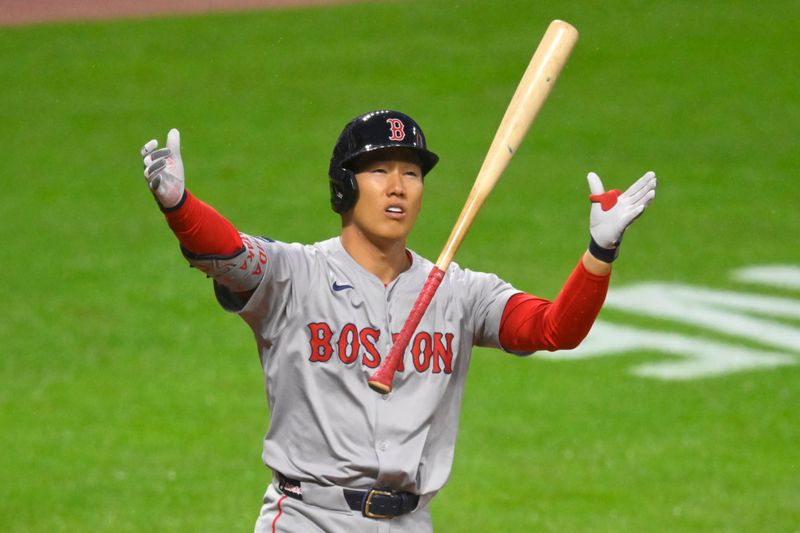 Apr 23, 2024; Cleveland, Ohio, USA; Boston Red Sox left fielder Masataka Yoshida (7) tosses his bat after hitting a foul ball in the eighth inning against the Cleveland Guardians at Progressive Field. Mandatory Credit: David Richard-USA TODAY Sports