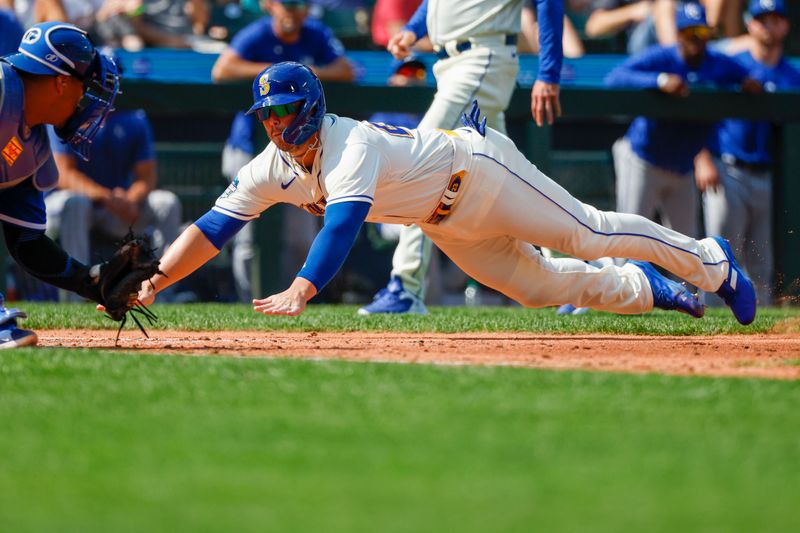 Aug 27, 2023; Seattle, Washington, USA; Seattle Mariners first baseman Ty France (23) attempts to score a run against the Kansas City Royals during the sixth inning at T-Mobile Park. Mandatory Credit: Joe Nicholson-USA TODAY Sports