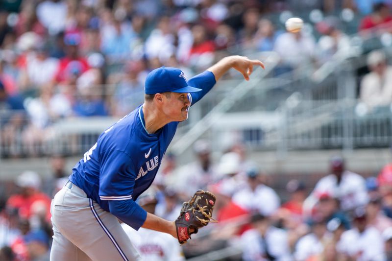 Sep 8, 2024; Cumberland, Georgia, USA; Toronto Blue Jays pitcher Brendon Little (54) pitches the ball against the Atlanta Braves during the seventh inning at Truist Park. Mandatory Credit: Jordan Godfree-Imagn Images