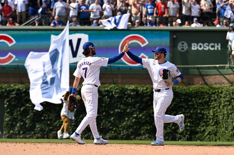 Jun 15, 2024; Chicago, Illinois, USA;  Chicago Cubs shortstop Dansby Swanson (7) and outfielder Ian Happ (8) after the game against the St. Louis Cardinals  at Wrigley Field. Mandatory Credit: Matt Marton-USA TODAY Sports