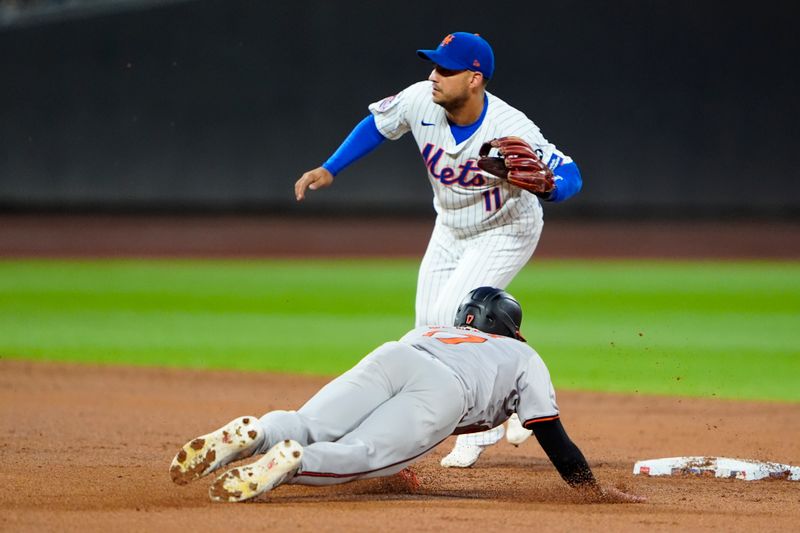 Aug 19, 2024; New York City, New York, USA; Baltimore Orioles center fielder Colton Cowser (17) steals second base as New York Mets second baseman Jose Iglesias (11) waits for the throw during the third inning at Citi Field. Mandatory Credit: Gregory Fisher-USA TODAY Sports