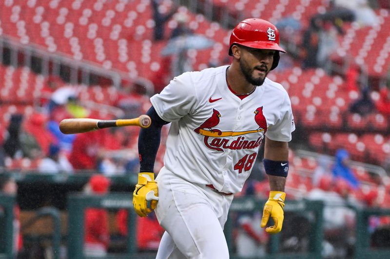 Apr 10, 2024; St. Louis, Missouri, USA;  St. Louis Cardinals catcher Ivan Herrera (48) flips his bat after hitting a solo home run against the Philadelphia Phillies during the second inning at Busch Stadium. Mandatory Credit: Jeff Curry-USA TODAY Sports