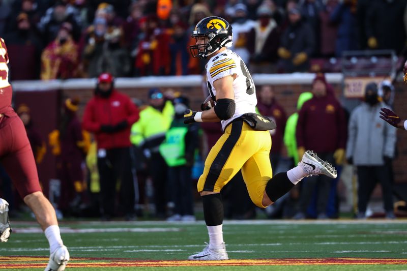 Nov 19, 2022; Minneapolis, Minnesota, USA; Iowa Hawkeyes tight end Sam LaPorta (84) completes a catch against the Minnesota Golden Gophers during the first quarter at Huntington Bank Stadium. Mandatory Credit: Matt Krohn-USA TODAY Sports