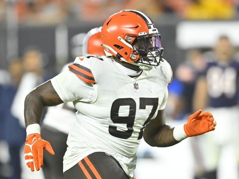 Cleveland Browns defensive tackle Perrion Winfrey (97) rushes the passer runs during an NFL preseason football game against the Chicago Bears, Saturday, Aug. 27, 2022, in Cleveland. The Bears won 21-20. (AP Photo/David Richard)