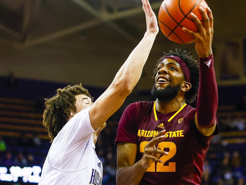 Jan 26, 2023; Seattle, Washington, USA; Arizona State Sun Devils forward Warren Washington (22) spins away from Washington Huskies center Braxton Meah (34) to shoot during the first half at Alaska Airlines Arena at Hec Edmundson Pavilion. Mandatory Credit: Joe Nicholson-USA TODAY Sports