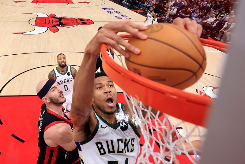 CHICAGO, ILLINOIS - NOVEMBER 30: Giannis Antetokounmpo #34 of the Milwaukee Bucks dunks the ball during the second half against the Chicago Bulls at the United Center on November 30, 2023 in Chicago, Illinois. NOTE TO USER: User expressly acknowledges and agrees that, by downloading and or using this photograph, User is consenting to the terms and conditions of the Getty Images License Agreement. (Photo by Justin Casterline/Getty Images)