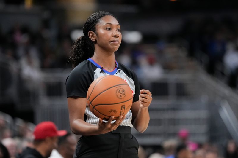 INDIANAPOLIS, INDIANA - OCTOBER 17: Referee Danielle Scott looks on during a preseason game between the Charlotte Hornets and the Indiana Pacers at Gainbridge Fieldhouse on October 17, 2024 in Indianapolis, Indiana. NOTE TO USER: User expressly acknowledges and agrees that, by downloading and or using this photograph, User is consenting to the terms and conditions of the Getty Images License Agreement. (Photo by Dylan Buell/Getty Images)