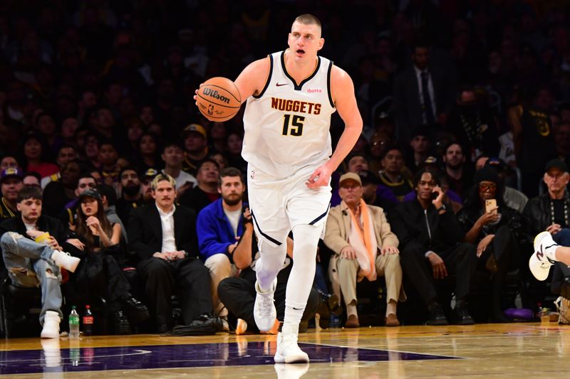 LOS ANGELES, CA - FEBRUARY 8: Nikola Jokic #15 of the Denver Nuggets dribbles the ball during the game against the Los Angeles Lakers on February 8, 2024 at Crypto.Com Arena in Los Angeles, California. NOTE TO USER: User expressly acknowledges and agrees that, by downloading and/or using this Photograph, user is consenting to the terms and conditions of the Getty Images License Agreement. Mandatory Copyright Notice: Copyright 2024 NBAE (Photo by Adam Pantozzi/NBAE via Getty Images)