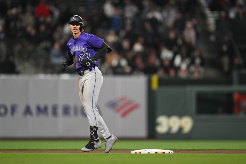 May 1, 2025; San Francisco, California, USA; Colorado Rockies left fielder Jordan Beck (27) celebrates his RBI double against the San Francisco Giants in the eighth inning at Oracle Park. Mandatory Credit: Eakin Howard-Imagn Images