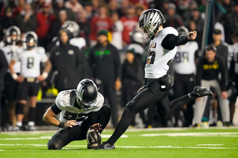 Nov 16, 2024; Madison, Wisconsin, USA;  Oregon Ducks kicker Atticus Sappington (36) kicks a field goal during the fourth quarter against the Wisconsin Badgers at Camp Randall Stadium. Mandatory Credit: Jeff Hanisch-Imagn Images