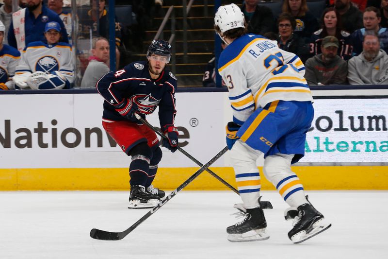 Feb 23, 2024; Columbus, Ohio, USA; Columbus Blue Jackets Forward Cole Sillinger (4) looks to pass as Buffalo Sabres defenseman Ryan Johnson (33) defends during the third period at Nationwide Arena. Mandatory Credit: Russell LaBounty-USA TODAY Sports