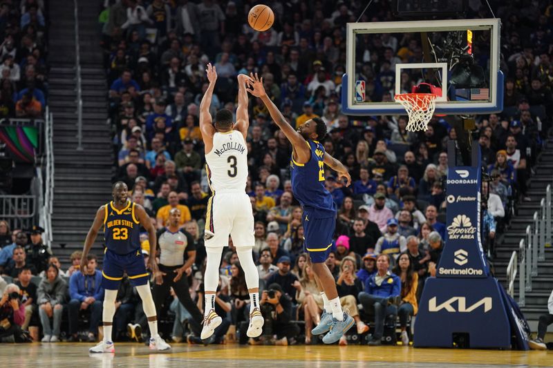 SAN FRANCISCO, CA - APRIL 12: CJ McCollum #3 of the New Orleans Pelicans attempts a three-point jump shot in the second quarter against Andrew Wiggins #22 of the Golden State Warriors at Chase Center on April 12, 2024 in San Francisco, California. NOTE TO USER: User expressly acknowledges and agrees that, by downloading and/or using this photograph, User is consenting to the terms and conditions of the Getty Images License Agreement. (Photo by Kavin Mistry/Getty Images)