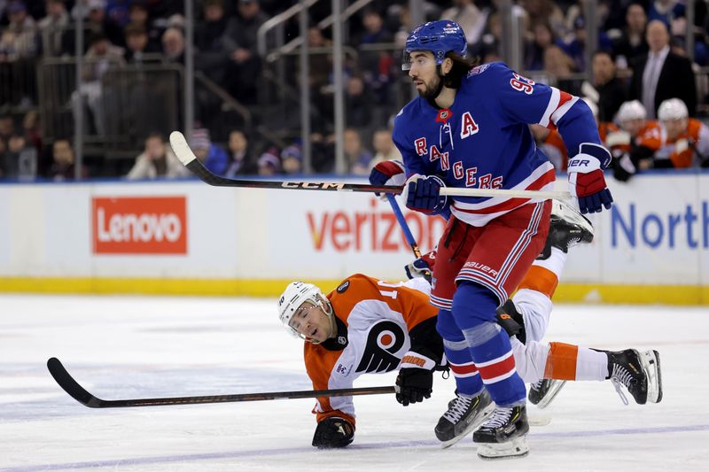 Dec 20, 2025; New York, New York, USA; Philadelphia Flyers right wing Bobby Brink (10) is knocked to the ice by New York Rangers center Mika Zibanejad (93) during the first period at Madison Square Garden. Mandatory Credit: Brad Penner-Imagn Images