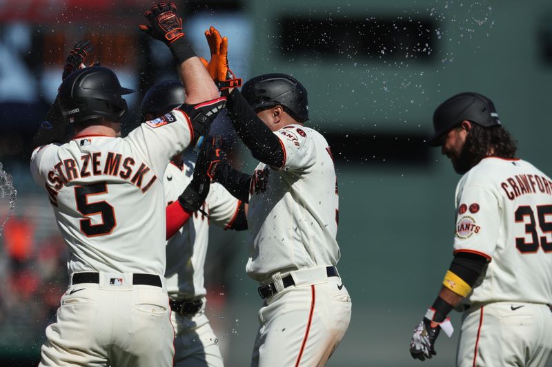 Sep 13, 2023; San Francisco, California, USA; San Francisco Giants first baseman LaMonte Wade Jr. (31) hits an rbi sac fly during the tenth inning against the Cleveland Guardians at Oracle Park. Mandatory Credit: Sergio Estrada-USA TODAY Sports