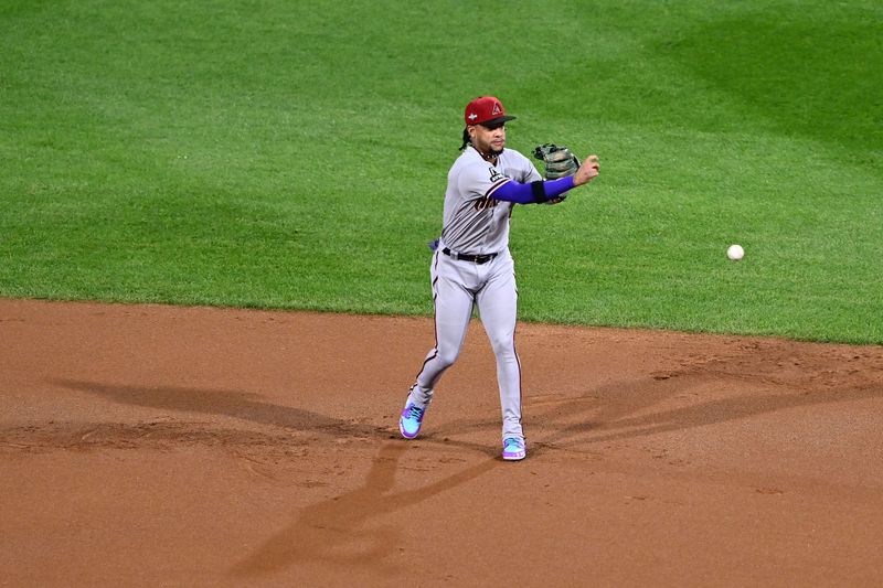 Oct 17, 2023; Philadelphia, Pennsylvania, USA; Arizona Diamondbacks second baseman Ketel Marte (4) makes a throw to first base against the Philadelphia Phillies in the first inning for game two of the NLCS for the 2023 MLB playoffs at Citizens Bank Park. Mandatory Credit: Kyle Ross-USA TODAY Sports