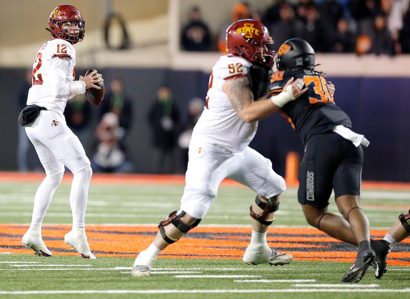 Nov 12, 2022; Stillwater, Oklahoma, USA;  Iowa State Cyclones quarterback Hunter Dekkers (12) drops back to throw a pass against the Oklahoma State Cowboys in the fourth quarter at Boone Pickens Stadium. OSU won 20-14. Mandatory Credit: Sarah Phipps-USA TODAY Sports
