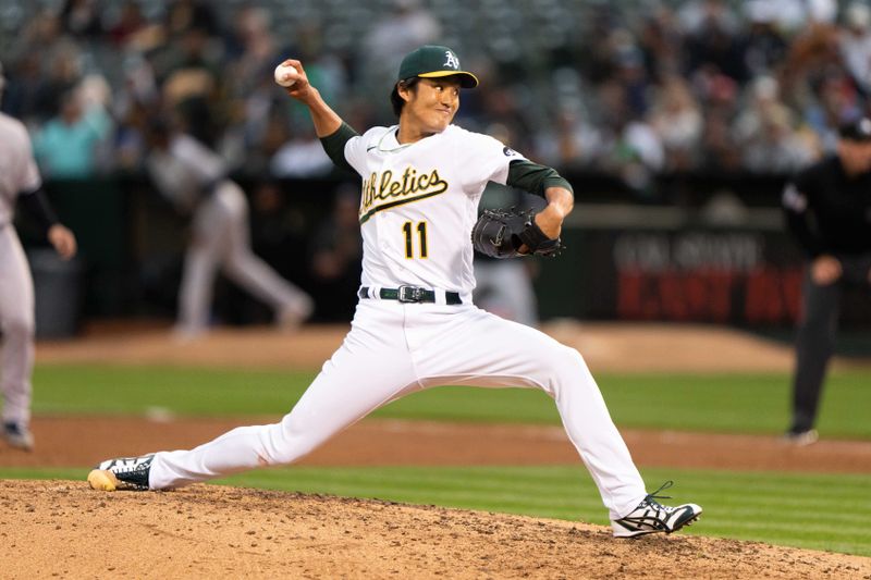 Jun 28, 2023; Oakland, California, USA;  Oakland Athletics relief pitcher Shintaro Fujinami (11) pitches during the fifth inning against the New York Yankees at Oakland-Alameda County Coliseum. Mandatory Credit: Stan Szeto-USA TODAY Sports