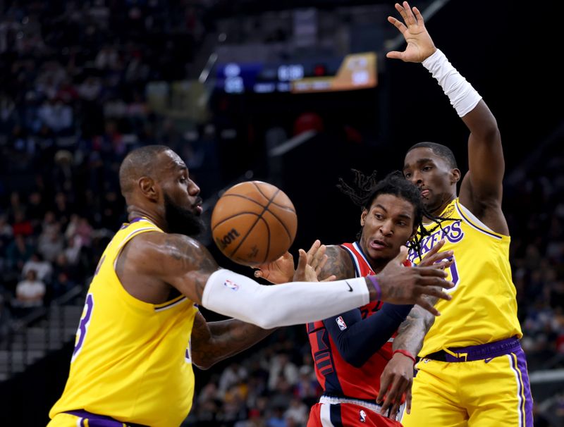 INGLEWOOD, CALIFORNIA - FEBRUARY 04: Kevin Porter Jr. #77 of the LA Clippers attempts a pass between LeBron James #23 and Shake Milton #20 of the Los Angeles Lakers during the first half at Intuit Dome on February 04, 2025 in Inglewood, California. (Photo by Harry How/Getty Images) User expressly acknowledges and agrees that, by downloading and or using this photograph, User is consenting to the terms and conditions of the Getty Images License Agreement. (Photo by Harry How/Getty Images)