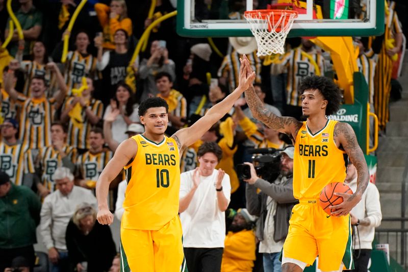 Jan 13, 2024; Waco, Texas, USA; Baylor Bears guard RayJ Dennis (10) and forward Jalen Bridges (11) react after the victory over the Cincinnati Bearcats at Paul and Alejandra Foster Pavilion. Mandatory Credit: Raymond Carlin III-USA TODAY Sports