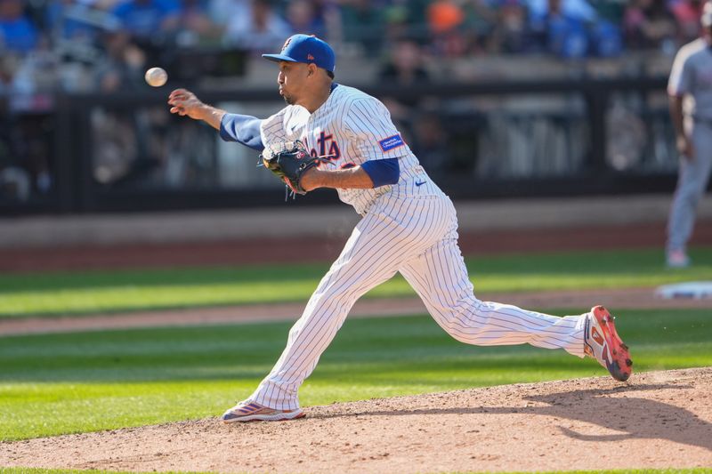 Sep 14, 2025; New York City, New York, USA; New York Mets pitcher Edwin Diaz (39) delivers a pitch against the Texas Rangers during the ninth inning at Citi Field. Mandatory Credit: Gregory Fisher-Imagn Images