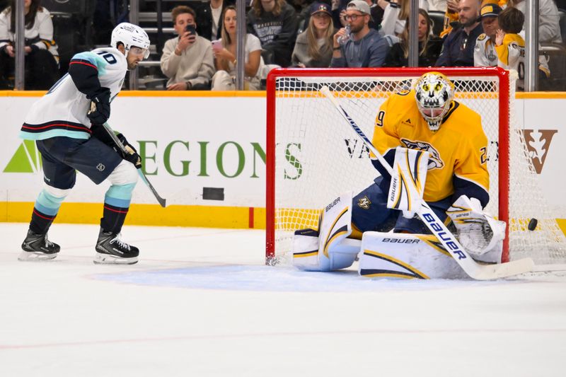 Mar 19, 2026; Nashville, Tennessee, USA;  Nashville Predators goaltender Justus Annunen (29) blocks the shot of Seattle Kraken center Matty Beniers (10) during the second period at Bridgestone Arena. Mandatory Credit: Steve Roberts-Imagn Images