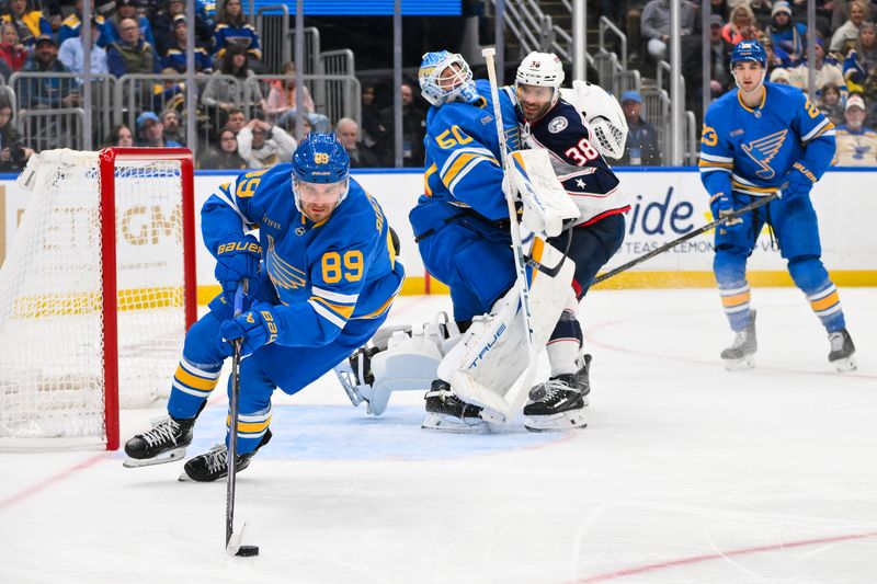 Jan 31, 2026; St. Louis, Missouri, USA; St. Louis Blues left wing Pavel Buchnevich (89) controls the puck as Columbus Blue Jackets center Boone Jenner (38) collides with goaltender Jordan Binnington (50) during the third period at Enterprise Center. Mandatory Credit: Jeff Curry-Imagn Images