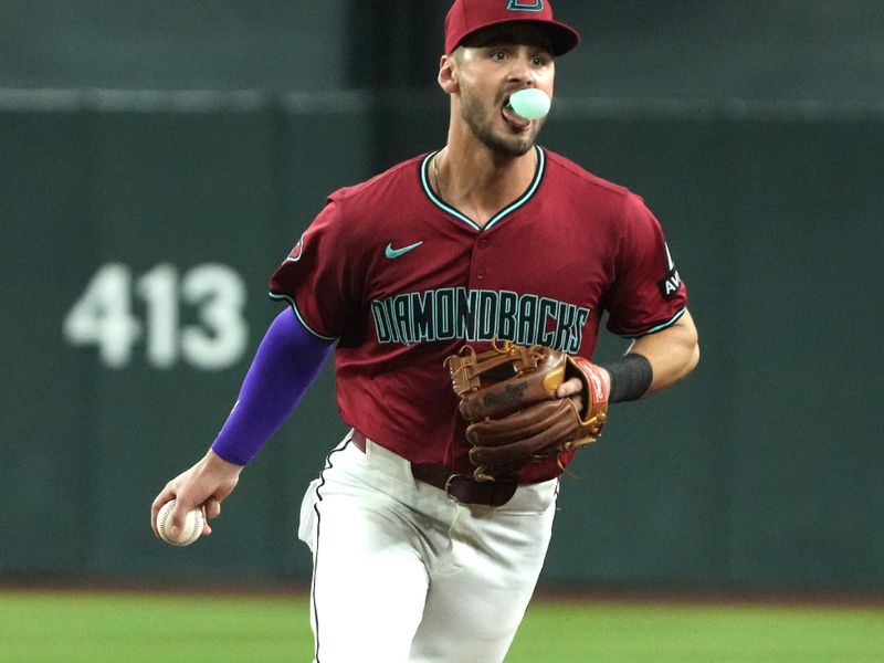 Jun 29, 2024; Phoenix, Arizona, USA; Arizona Diamondbacks second baseman Blaze Alexander (9) makes the play for an out against the Oakland Athletics in the eighth inning at Chase Field. Mandatory Credit: Rick Scuteri-USA TODAY Sports