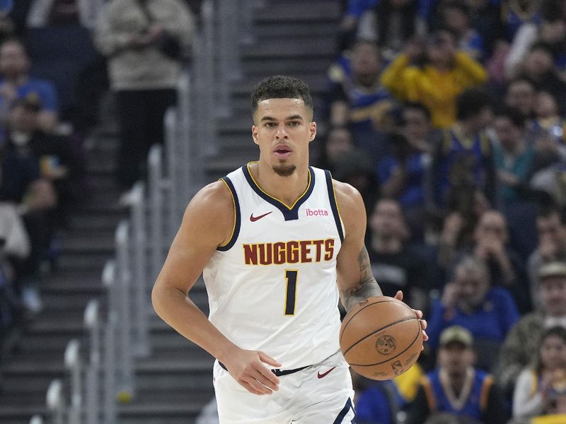 SAN FRANCISCO, CALIFORNIA - FEBRUARY 25: Michael Porter Jr. #1 of the Denver Nuggets dribbles the ball up court against the Golden State Warriors during the first quarter of an NBA basketball game at Chase Center on February 25, 2024 in San Francisco, California. NOTE TO USER: User expressly acknowledges and agrees that, by downloading and or using this photograph, User is consenting to the terms and conditions of the Getty Images License Agreement. (Photo by Thearon W. Henderson/Getty Images)