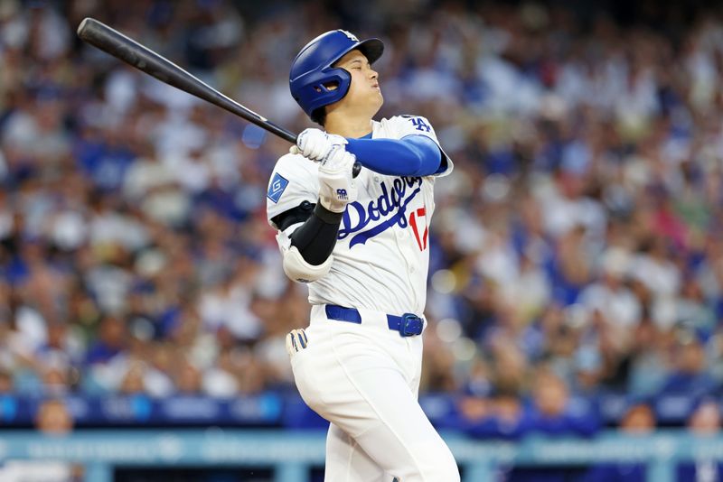 Jun 2, 2025; Los Angeles, California, USA; Los Angeles Dodgers two-way player Shohei Ohtani (17) reacts after a hit during the third inning against the New York Mets during the third inning against the New York Mets at Dodger Stadium. Mandatory Credit: Jason Parkhurst-Imagn Images