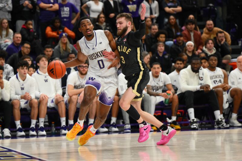 Jan 15, 2025; Seattle, Washington, USA; Washington Huskies guard Mekhi Mason (0) dribbles the ball while guarded by Purdue Boilermakers guard Braden Smith (3) during the second half at Alaska Airlines Arena at Hec Edmundson Pavilion. Mandatory Credit: Steven Bisig-Imagn Images