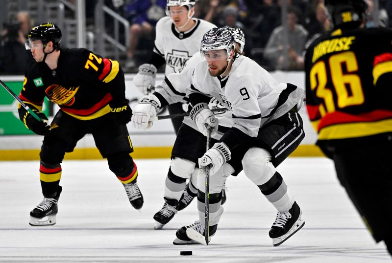 Apr 10, 2023; Los Angeles, California, USA;  Los Angeles Kings right wing Adrian Kempe (9) takes the puck down ice in the second period against the Vancouver Canucks at Crypto.com Arena. Mandatory Credit: Jayne Kamin-Oncea-USA TODAY Sports