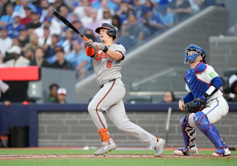 Jun 4, 2024; Toronto, Ontario, CAN; Baltimore Orioles first baseman Ryan Mountcastle (6) hits a three-run home run against the Toronto Blue Jays during the third inning at Rogers Centre. Mandatory Credit: John E. Sokolowski-USA TODAY Sports