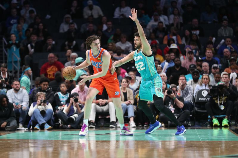 CHARLOTTE, NC - APRIL 7: Josh Giddey #3 of the Oklahoma City Thunder dribbles the ball during the game against the Charlotte Hornets on April 7, 2024 at Spectrum Center in Charlotte, North Carolina. NOTE TO USER: User expressly acknowledges and agrees that, by downloading and or using this photograph, User is consenting to the terms and conditions of the Getty Images License Agreement.  Mandatory Copyright Notice:  Copyright 2024 NBAE (Photo by Brock Williams-Smith/NBAE via Getty Images)