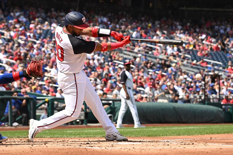 Sep 1, 2024; Washington, District of Columbia, USA; Washington Nationals catcher Keibert Ruiz (20) hits the ball into play against the Chicago Cubs during the second inning at Nationals Park. Mandatory Credit: Rafael Suanes-USA TODAY Sports