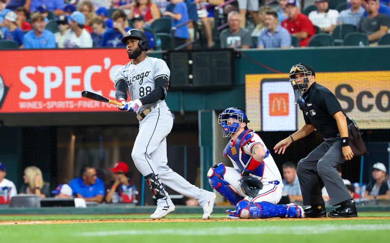 Jul 24, 2024; Arlington, Texas, USA; Chicago White Sox center fielder Luis Robert Jr. (88) hits a home run during the third inning against the Texas Rangers at Globe Life Field. Mandatory Credit: Kevin Jairaj-USA TODAY Sports