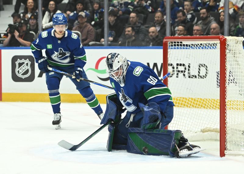 Feb 25, 2026; Vancouver, British Columbia, CAN; Vancouver Canucks goaltender Nikita Tolopilo (60) makes a save against Winnipeg Jets during the second period at Rogers Arena. Mandatory Credit: Simon Fearn-Imagn Images